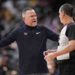 
              Denver Nuggets head coach Michael Malone, left, argues with referee Matt Boland in the second half of an NBA basketball game against the Los Angeles Lakers, Monday, Jan. 9, 2023, in Denver. (AP Photo/David Zalubowski)
            
