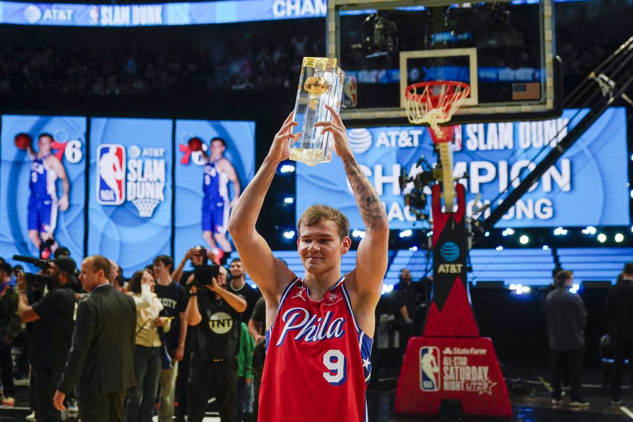 Mac McClung of the Philadelphia 76ers reacts after winning the slam dunk competition of the NBA bas...