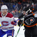 
              Montreal Canadiens' Jordan Harris, left, and Philadelphia Flyers' Justin Braun battle for position during the second period of an NHL hockey game, Friday, Feb. 24, 2023, in Philadelphia. (AP Photo/Matt Slocum)
            