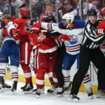 
              Edmonton Oilers left wing Evander Kane (91) punches Detroit Red Wings center Dylan Larkin (71) in the third period of an NHL hockey game Tuesday, Feb. 7, 2023, in Detroit. (AP Photo/Paul Sancya)
            