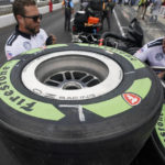 
              FILE - Tires made from natural rubber derived from a desert shrub, sit on a cart before the pit stop contest ahead of the Indianapolis 500 auto race at Indianapolis Motor Speedway, Friday, May 27, 2022, in Indianapolis. Bridgestone Americas said Thursday, Feb. 23, 2023, it has used the offseason to incorporate more sustainable and bio-circular materials into its tires this season, which has made it possible for Firestone to provide tires made with rubber derived from the guayule desert shrub at all five street circuits of the 17-race IndyCar season. (AP Photo/Darron Cummings, File)
            