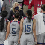 
              FILE - First lady of the United States Jill Biden talks with the United States team following their women's 3-on-3 basketball game against France at the 2020 Summer Olympics, July 24, 2021, in Tokyo, Japan. (AP Photo/Jeff Roberson, File)
            