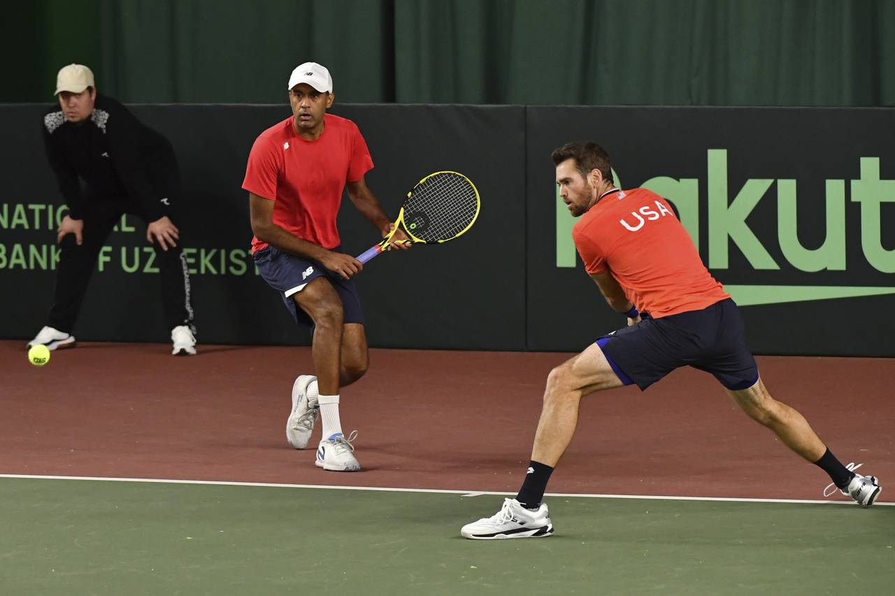 Austin Krajicek, right, and Rajeev Ram of the USA in action against Sergey Fomin and Sanjar Fayziev...