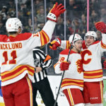 
              Calgary Flames center Mikael Backlund (11), left wing Andrew Mangiapane (88) and left wing Jakob Pelletier, right, celebrate after Pelletier's goal against the Vegas Golden Knights during the first period of an NHL hockey game Thursday, Feb. 23, 2023, in Las Vegas. (AP Photo/David Becker)
            