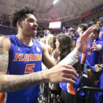
              Florida guard Will Richard celebrates with fans after the second half of an NCAA college basketball game Wednesday, Feb. 1, 2023, in Gainesville, Fla. (AP Photo/Alan Youngblood)
            