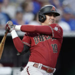 
              FILE -Arizona Diamondbacks' Josh Rojas bats during a baseball game against the Kansas City Royals Wednesday, Aug. 24, 2022, in Kansas City, Mo. (AP Photo/Charlie Riedel, File)
            