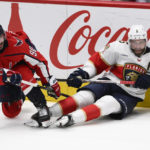 
              Washington Capitals left wing Marcus Johansson (90) and Florida Panthers defenseman Aaron Ekblad (5) battle along the boards during the third period of an NHL hockey game Thursday, Feb. 16, 2023, in Washington. (AP Photo/Nick Wass)
            