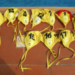 
              Water polo caps are displayed poolside during an Awutu Winton Water Polo Club competition at the University of Ghana in Accra, Ghana, Saturday, Jan. 14, 2023. Former water polo pro Prince Asante is training young players in the sport in his father's homeland of Ghana, where swimming pools are rare and the ocean is seen as dangerous. (AP Photo/Misper Apawu)
            