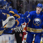 
              Buffalo Sabres center Tage Thompson, right, celebrates after scoring against the Calgary Flames during the first period of an NHL hockey game in Buffalo, N.Y., Saturday, Feb. 11, 2023. (AP Photo/Adrian Kraus)
            