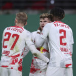 
              Leipzig's Timo Werner, center, celebrates scoring the 3:1 against Hoffenheim with Konrad Laimer, left, and Mohamed Simakan during the German Soccer Cup round of 16 soccer match at the Red Bull Arena in Leipzig, Germany, Wednesday, Feb. 1, 2023. (Jan Woitas/dpa via AP)
            