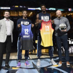 
              Memphis Grizzlies guard Ja Morant (12) and forward Jaren Jackson Jr. (13), standing with general manager Zach Kleiman, left, and coach Taylor Jenkins, are recognized for their upcoming appearance in the NBA All-Star, before the team's NBA matchup against the Utah Jazz on Wednesday, Feb. 15, 2023, in Memphis, Tenn. (AP Photo/Brandon Dill)
            
