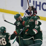 
              Minnesota Wild left wing Kirill Kaprizov (97), right, celebrates with teammates after scoring his second goal against the Columbus Blue Jackets during the third period of an NHL hockey game Sunday, Feb. 26, 2023, in St. Paul, Minn. (AP Photo/Abbie Parr)
            