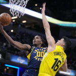 
              Indiana Pacers guard Bennedict Mathurin (00) shoots over Utah Jazz forward Simone Fontecchio (16) during the first half of an NBA basketball game in Indianapolis, Monday, Feb. 13, 2023. (AP Photo/Michael Conroy)
            