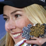 
              United States' Mikaela Shiffrin shows her silver medal of the women's World Championship slalom, the gold medal of the giant slalom and the silver of the combined, in Meribel, France, Saturday Feb. 18, 2023. (AP Photo/Alessandro Trovati)
            