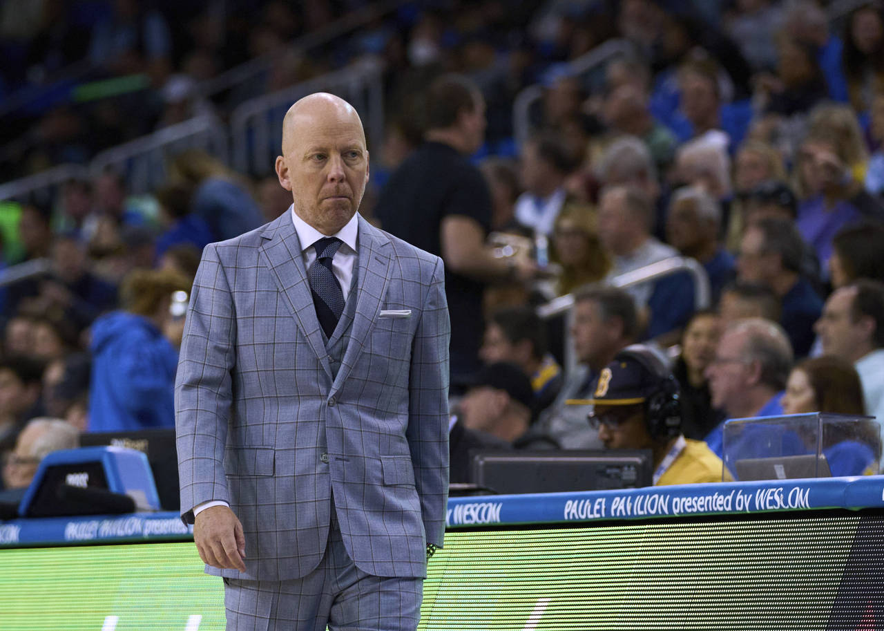UCLA coach Mick Cronin walks the sideline during the first half of the team's NCAA college basketba...