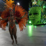 
              A performer from the Imperio Serrano samba school takes part in Carnival celebrations at the Sambadrome in Rio de Janeiro on Sunday, Feb.19, 2023. (AP Photo/Silvia Izquierdo)
            