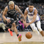 
              Sacramento Kings' Keegan Murray, right, and San Antonio Spurs' Jeremy Sochan fight for possession during the first half of an NBA basketball game, Wednesday, Feb. 1, 2023, in San Antonio. (AP Photo/Darren Abate)
            
