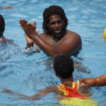 
              Asante Prince, the founder of Ghana's Awatu Winton Water Polo Club, oversees a training session in a swimming pool at the University of Ghana ahead of a competition in Accra, Ghana, Saturday, Jan. 14, 2023. Former water polo pro Asante Prince is training young players in the sport in his father's homeland of Ghana, where swimming pools are rare and the ocean is seen as dangerous. (AP Photo/Misper Apawu)
            