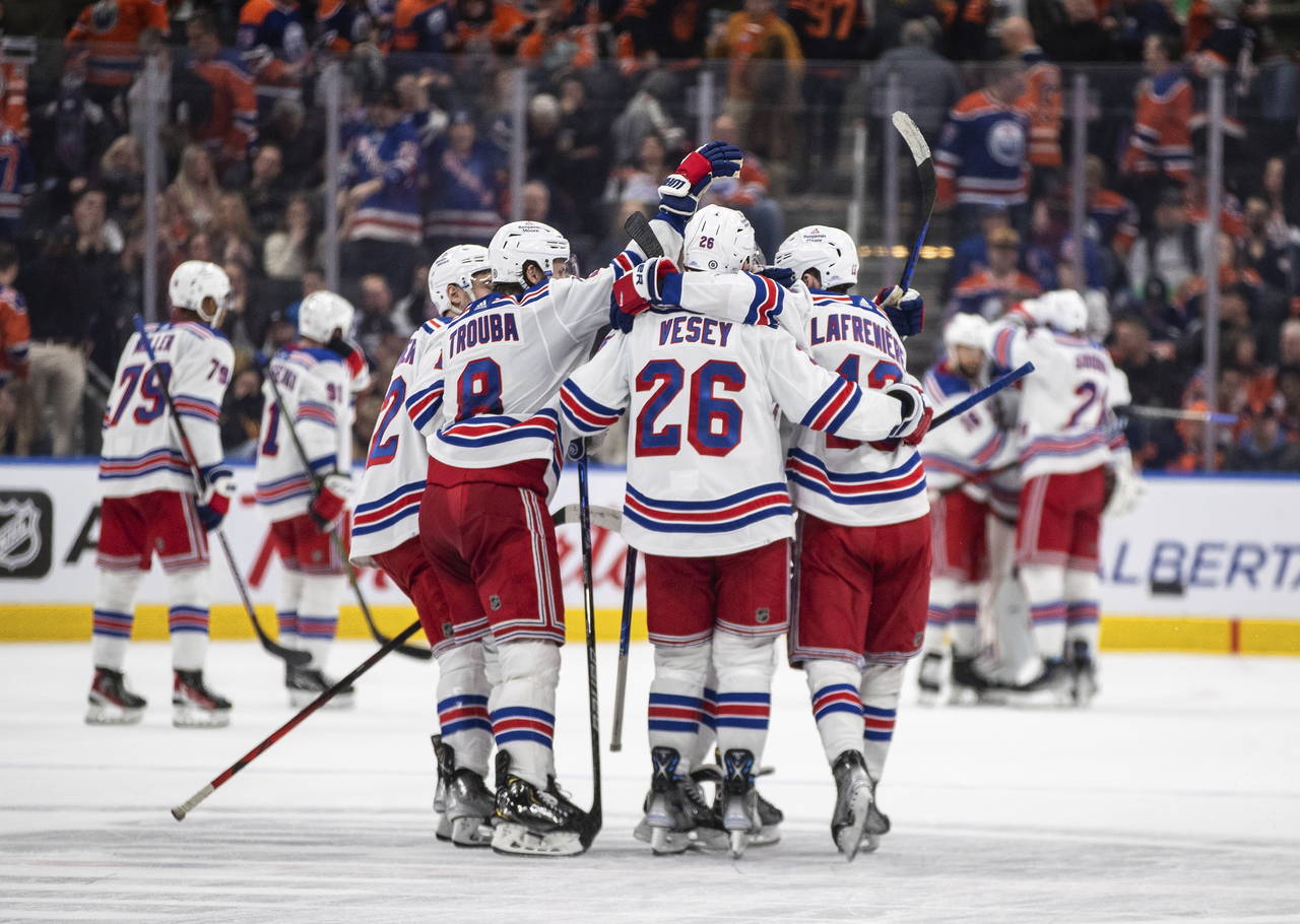 New York Rangers celebrate a shootout win over the Edmonton Oilers during an NHL hockey game Friday...