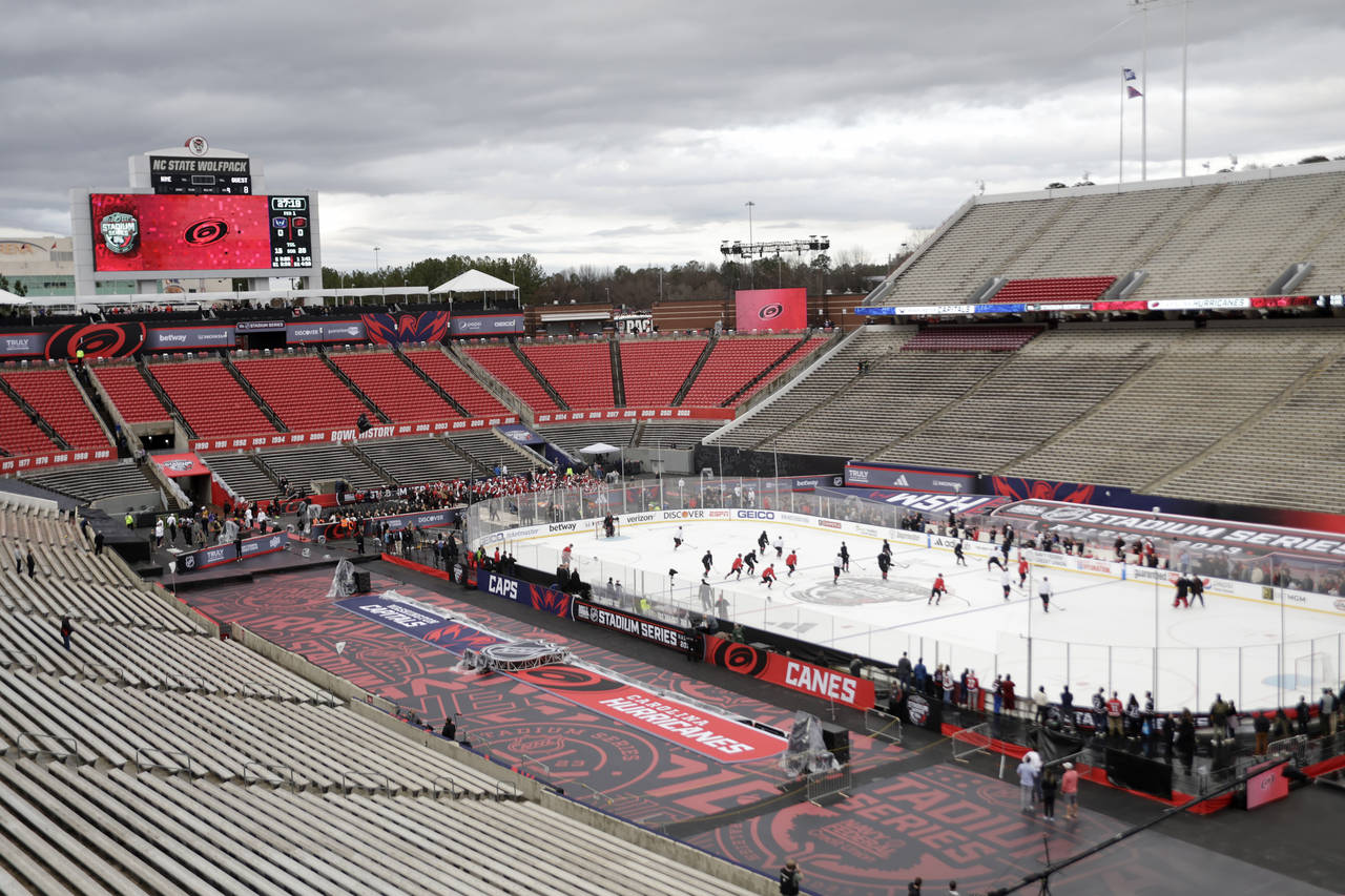 Carolina Hurricanes skate during practice for Saturday's Stadium Series outdoor NHL hockey game aga...