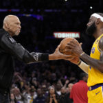 
              Kareem Abdul-Jabbar, left, hands the ball to Los Angeles Lakers forward LeBron James after passing Abdul-Jabbar to become the NBA's all-time leading scorer during the second half of an NBA basketball game against the Oklahoma City Thunder Tuesday, Feb. 7, 2023, in Los Angeles. (AP Photo/Ashley Landis)
            