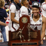 
              South Carolina forward Aliyah Boston stands with the SEC regular season trophy after South Carolina defeated Georgia 73-63 in an NCAA college basketball game in Columbia, S.C., Sunday, Feb. 26, 2023. (AP Photo/Nell Redmond)
            