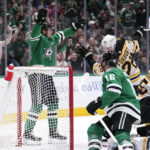 
              Dallas Stars center Roope Hintz, left rear, celebrates after scoring against Boston Bruins' Linus Ullmark (35) on an assist from Joe Pavelski (16) as Derek Forbort (28) helps defend on the play in the first period of an NHL hockey game, Tuesday, Feb. 14, 2023, in Dallas. (AP Photo/Tony Gutierrez)
            