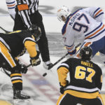 
              Pittsburgh Penguins center Sidney Crosby (87) and Edmonton Oilers center Connor McDavid (97) take the opening faceoff during the first period of an NHL hockey game, Thursday, Feb. 23, 2023, in Pittsburgh. (AP Photo/Philip G. Pavely)
            