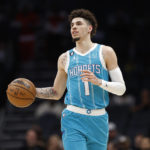 
              Charlotte Hornets guard LaMelo Ball brings the ball up during the first half of the team's NBA basketball game against the San Antonio Spurs on Wednesday, Feb. 15, 2023, in Charlotte, N.C. (AP Photo/Brian Westerholt)
            