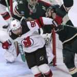 
              New Jersey Devils' Tomas Tatar (90) tries to fend off Minnesota Wild's Mats Zuccarello, right, during the third period of an NHL hockey game Saturday, Feb. 11, 2023, in St. Paul, Minn. Minnesota won 3-2 in a shootout. (AP Photo/Jim Mone)
            