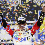 
              FILE - Kevin Harvick celebrates after winning a NASCAR Cup Series auto race at Richmond Raceway, Sunday, Aug. 14, 2022, in Richmond, Va. Harvick is looking for the exit ramp as he enters his final season as a NASCAR driver. This 75th season of NASCAR begins Sunday, Feb. 19, 2023, with the Daytona 500 and is a year of both celebration and transition. (AP Photo/Steve Helber, File)
            