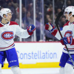 
              Montreal Canadiens' Jesse Ylonen, left, and Justin Barron celebrate after Ylonen's goal during the third period of an NHL hockey game against the Philadelphia Flyers, Friday, Feb. 24, 2023, in Philadelphia. (AP Photo/Matt Slocum)
            