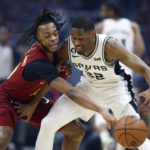 
              Cleveland Cavaliers guard Darius Garland defends against San Antonio Spurs guard Malaki Branham (22) during the first half of an NBA basketball game, Monday, Feb. 13, 2023, in Cleveland. (AP Photo/Ron Schwane)
            