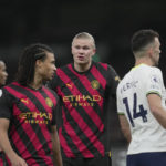 
              Manchester City's Erling Haaland, centre, speaks with Nathan Ake, 2nd left during an English Premier League soccer match between Tottenham Hotspur and Manchester City at the Tottenham Hotspur Stadium in London, Sunday, Feb. 5, 2023. (AP Photo/Kin Cheung)
            