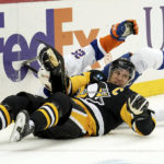 
              Pittsburgh Penguins center Sidney Crosby (87) collides with New York Islanders defenseman Sebastian Aho (25) during the second period of an NHL hockey game in Pittsburgh, Monday, Feb. 20, 2023. (AP Photo/Matt Freed)
            