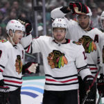 
              Chicago Blackhawks' Patrick Kane (88), Max Domi (13), Seth Jones (4) and Taylor Raddysh (11) celebrate afgter Domi scored in the second period of an NHL hockey game, Wednesday, Feb. 22, 2023, in Dallas. Kane had the assist on the goal. (AP Photo/Tony Gutierrez)
            