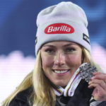 
              United States' Mikaela Shiffrin shows the gold medal of the alpine ski, women's World Championship super-G race, in Meribel, France, Wednesday, Feb. 8, 2023. (AP Photo/Alessandro Trovati)
            