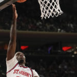 
              St. John's forward David Jones (23) makes a basket during the second half of an NCAA college basketball game against Providence, Saturday, Feb 11, 2023 in New York. (AP Photo/Bryan Woolston)
            