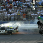 
              FILE -Carl Edwards flips after hitting Ryan Newman, left, on the last lap of the Aaron's 499 NASCAR Sprint Cup Series auto race at Talladega Superspeedway in Talladega, Ala. on Sunday, April 26, 2009. NASCAR’s next 75 years almost certainly will include at least a partially electric vehicle turning laps at Daytona International Speedway. It’s unfathomable to some, unconscionable to others. (AP Photo/Rainier Ehrhardt, File)
            