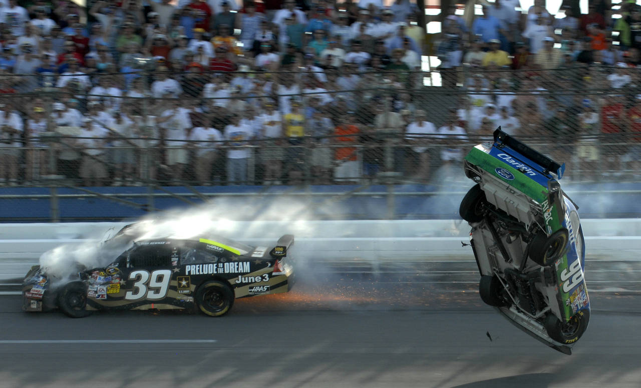 FILE -Carl Edwards flips after hitting Ryan Newman, left, on the last lap of the Aaron's 499 NASCAR...