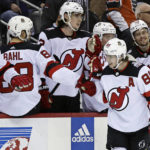 
              New Jersey Devils center Jack Hughes (86) celebrates with teammates after a goal against the Philadelphia Flyers during the third period of an NHL hockey game Saturday, Feb. 25, 2023, in Newark, N.J. (AP Photo/Adam Hunger)
            