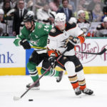 
              Anaheim Ducks defenseman John Klingberg (3) controls the puck as Dallas Stars left wing Jamie Benn (14) follows in the second period of an NHL hockey game, Monday, Feb. 6, 2023, in Dallas. (AP Photo/Tony Gutierrez)
            