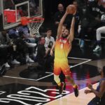 
              Team Giannis forward Jayson Tatum (0) dunks during the second half of the NBA basketball All-Star game Sunday, Feb. 19, 2023, in Salt Lake City. (AP Photo/Rob Gray)
            