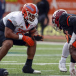 
              American lineman O'Cyrus Torrence of Florida (56) lines up for the play during practice for the Senior Bowl NCAA college football game Wednesday, Feb. 1, 2023, in Mobile, Ala.. (AP Photo/Butch Dill)
            