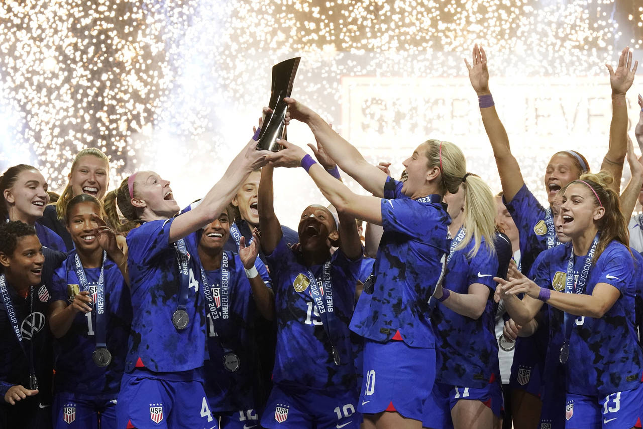United States women's soccer team lifts up and celebrates the SheBelieves Cup after winning the soc...