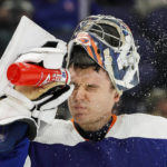 
              New York Islanders goaltender Ilya Sorokin (30) sprays water on his face during the third period of an NHL hockey game against the Ottawa Senators Tuesday, Feb. 14, 2023, in Elmont, N.Y. (AP Photo/Eduardo Munoz Alvarez)
            