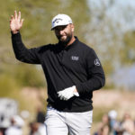 
              Jon Rahm acknowledges the crowd on the 15th hole after his eagle during the second round of the Phoenix Open golf tournament Friday Feb. 10, 2023, in Scottsdale, Ariz. (AP Photo/Darryl Webb)
            