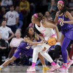 
              Texas A&M forward Janiah Barker, center, protects the ball as LSU guard Alexis Morris, left, reaches in as forward Angel Reese, right, looks on during the first half of an NCAA college basketball game, Sunday, Feb. 5, 2023, in College Station, Texas. (AP Photo/Michael Wyke)
            