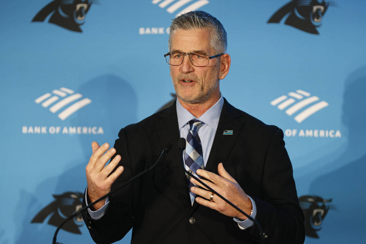 Carolina Panthers head coach Frank Reich answers a question during a news conference introducing hi...