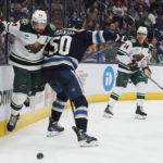 
              Columbus Blue Jackets' Eric Robinson, right front, checks Minnesota Wild's Matt Dumba during the second period of an NHL hockey game Thursday, Feb. 23, 2023, in Columbus, Ohio. (AP Photo/Jay LaPrete)
            